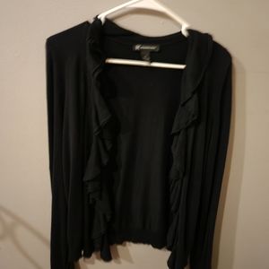 Ruffled neck and long sleeved black cardigan